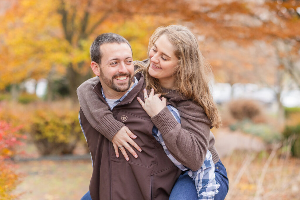 guy giving his fiancé a piggyback ride at Heidelberg University in Tiffin, Ohio