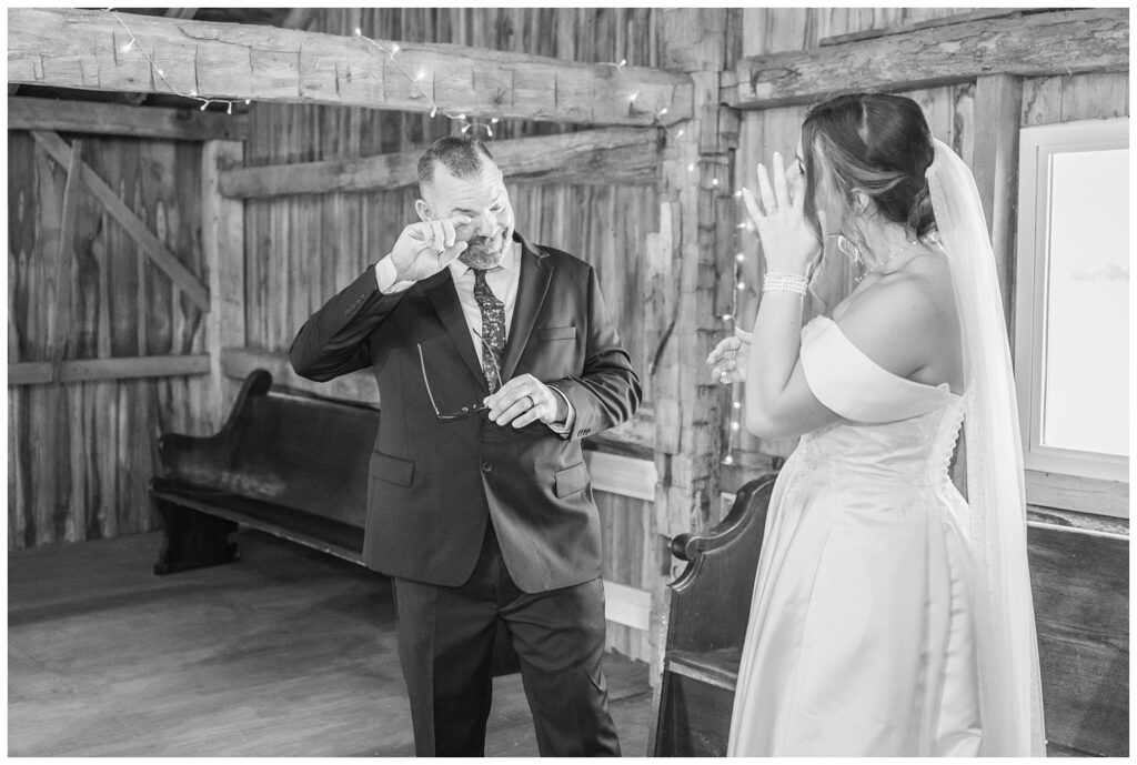 bride and her dad sharing some tears during their first look in the barn at the Octagon House