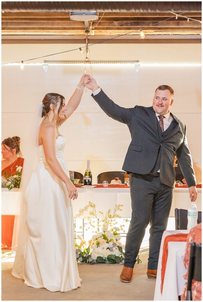 groom twirling the bride dring their first dance at Fremont, Ohio wedding reception