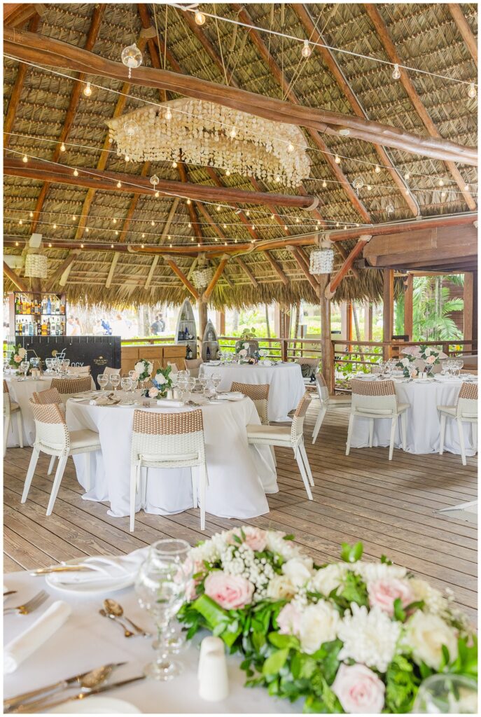 reception details under a thatched roof event space at Punta Cana Dreams Resort wedding