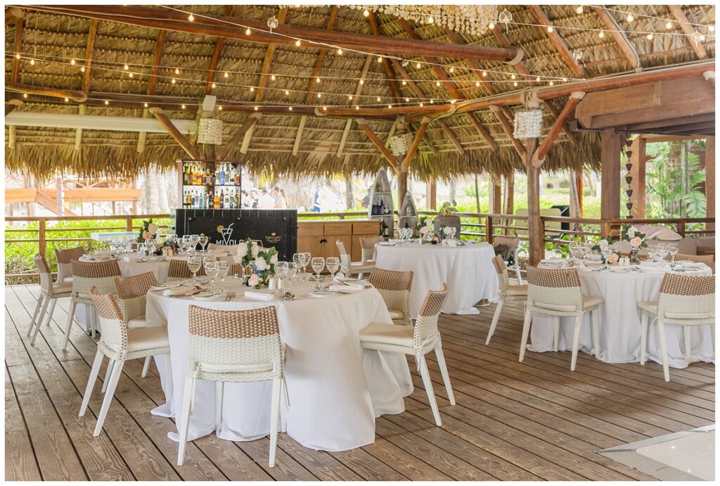 reception details under a thatched roof event space at Punta Cana Dreams Resort wedding