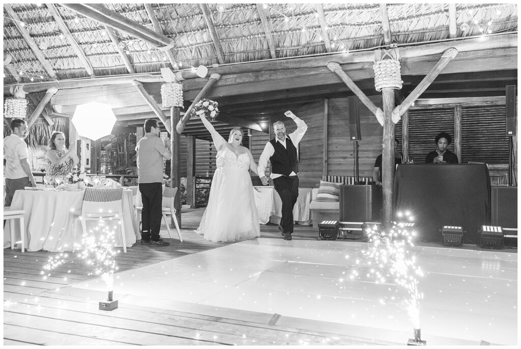 bride and groom walking into reception to the dance floor at Punta Cana wedding reception