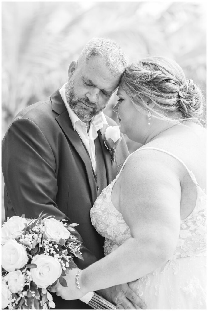 bride and groom taking a quiet moment while posing for bridal portraits at destination wedding