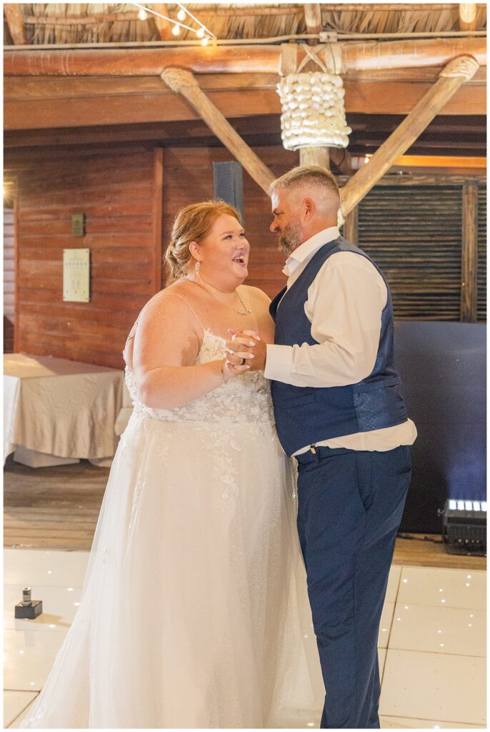 bride and groom dancing while guests look on during Punta Cana wedding reception