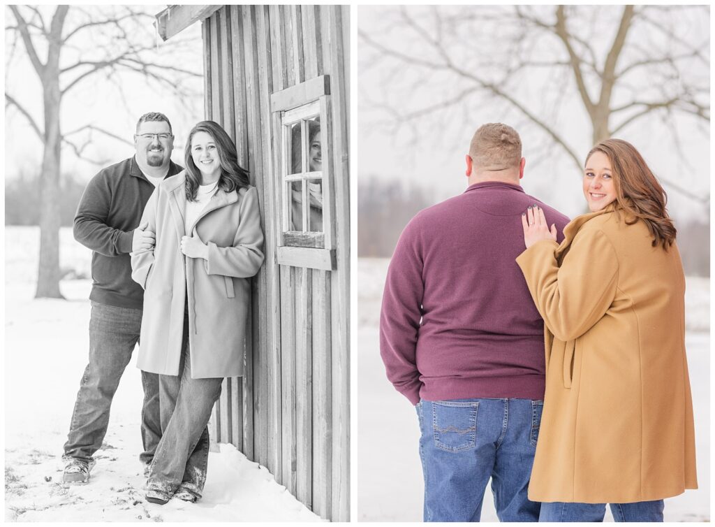 snowy engagement portraits with couple leaning against a barn