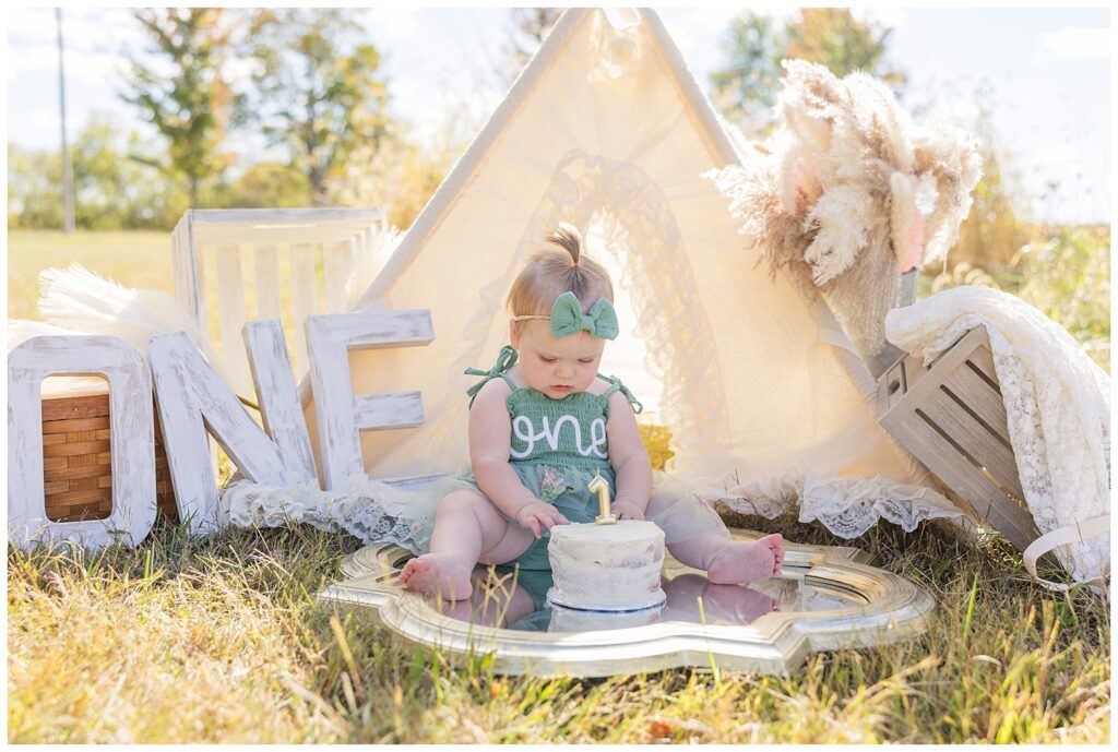 Tiffin, Ohio cake smash session with little girl sitting on a mirror