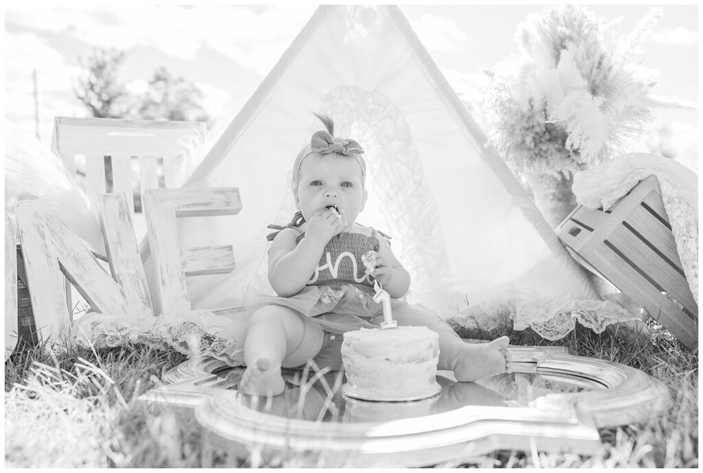 Tiffin, Ohio cake smash session with little girl sitting on a mirror eating cake