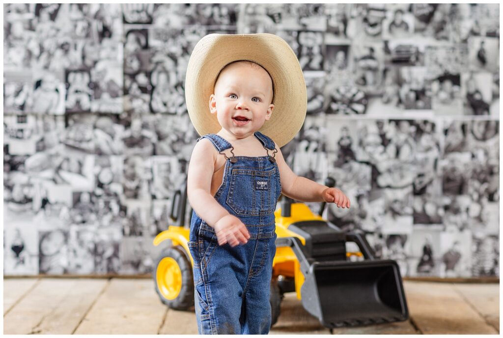 one year old boy wearing overalls and a cowboy hat in Fremont, Ohio