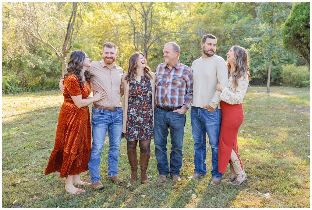 parents laughing while posing with their children and their spouses outdoors in Toledo, Ohio