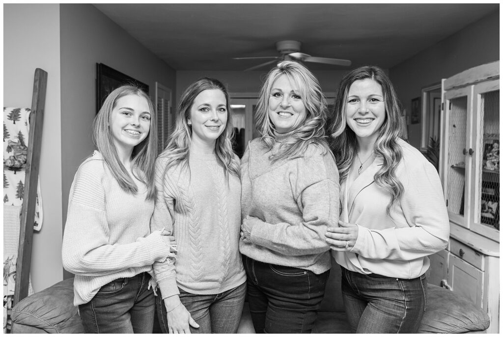 all four women of one family posing for their in-home extended session with Fremont, OH photographer