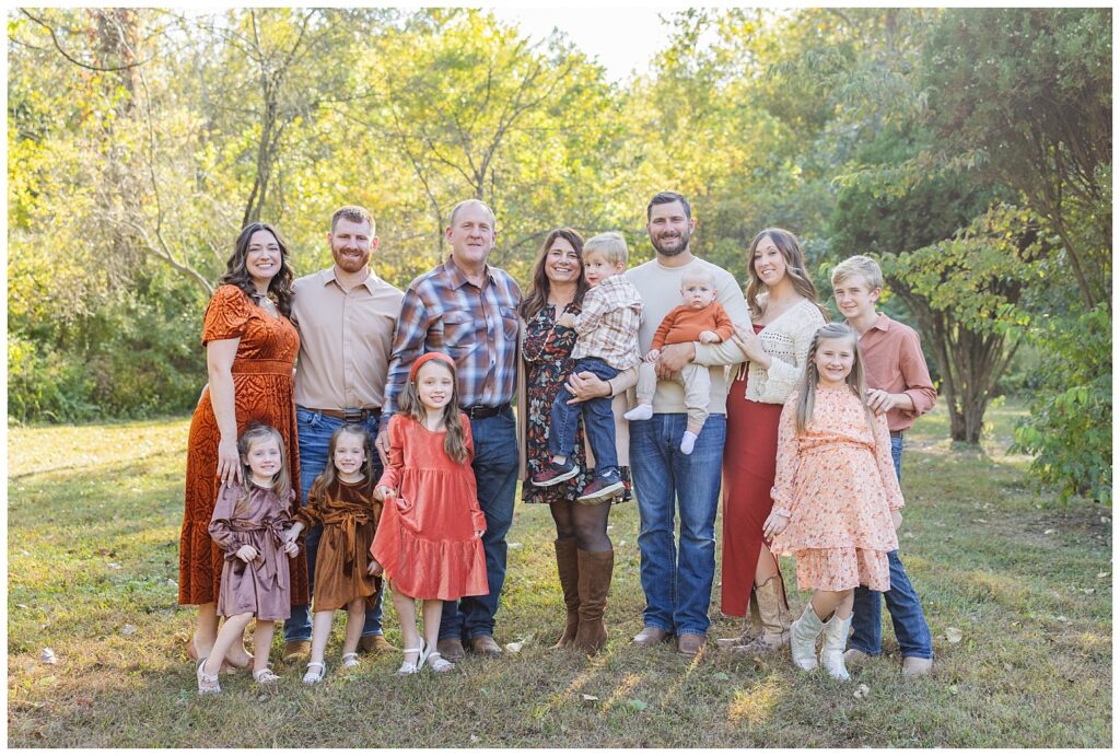full extended family session in a field near a pond with Tiffin, Ohio photographer